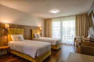 Ένα ή περισσότερα κρεβάτια σε δωμάτιο στο Hotel Residence Loren - contact & contactless check-in +37 φωτογραφίες