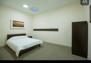 Ένα ή περισσότερα κρεβάτια σε δωμάτιο στο Home inn hotel