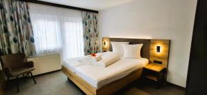 A bed or beds in a room at Haus Enzian