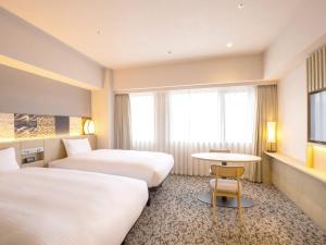 insomnia KYOTO OIKE客房内的一张或多张床位