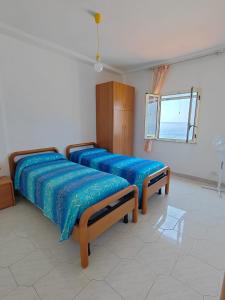 Postel nebo postele na pokoji v ubytování La Zagara House
