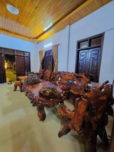 a wooden table in the middle of a room at Roll Huynh in Kon Plong