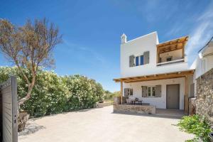 a view of the house from the driveway at Perla's Luxury Apartments in Livadi