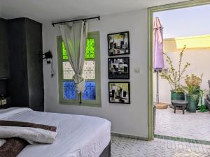 Postel nebo postele na pokoji v ubytování Riad Royal