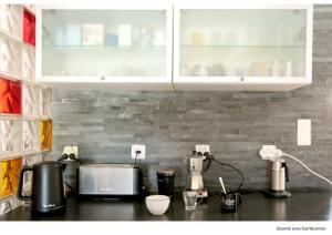 Η κουζίνα ή μικρή κουζίνα στο chambre avec spa, fitness et petit dejeuner