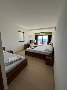 Postel nebo postele na pokoji v ubytování Hotel Ana Murter