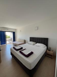 Postel nebo postele na pokoji v ubytování Hotel Ana Murter