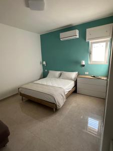 Katil atau katil-katil dalam bilik di B&B Spiaggia Le Dune