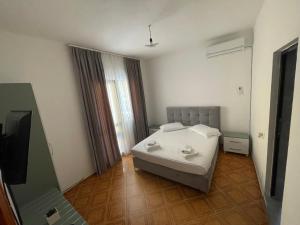 Postel nebo postele na pokoji v ubytování Hotel Ani