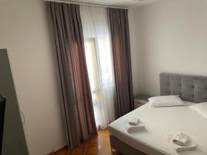 Postel nebo postele na pokoji v ubytování Hotel Ani