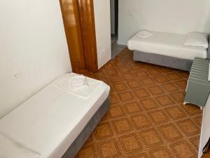 Postel nebo postele na pokoji v ubytování Hotel Ani