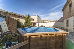 a hot tub in the backyard of a house at Abánades in Melgar de Fernamental