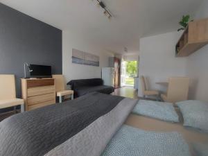 Postel nebo postele na pokoji v ubytování Germering Apartmanok