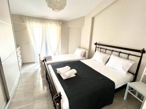 Postel nebo postele na pokoji v ubytování Filikouri Rooms