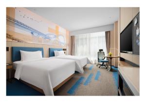 TV a/nebo společenská místnost v ubytování 南宁兴宁希尔顿欢朋酒店 Hampton by Hilton Nanning Xingning