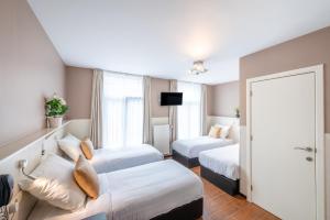 Katil atau katil-katil dalam bilik di Hotel Barry