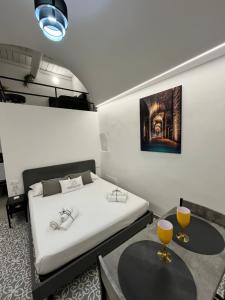 Letto o letti in una camera di Cisternone Suites