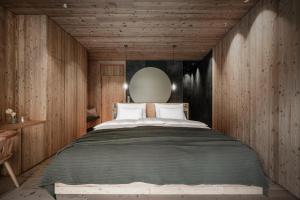 A bed or beds in a room at OLM Nature Escape - Eco Aparthotel