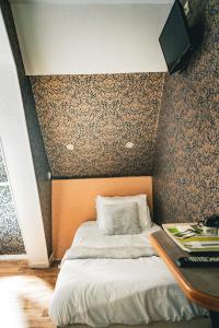 Postel nebo postele na pokoji v ubytování Hotel Central Anzac