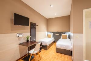 Katil atau katil-katil dalam bilik di Hotel Barry