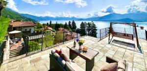 a balcony with a view of a body of water at Serra Boutique Villa & Spa in Ghiffa