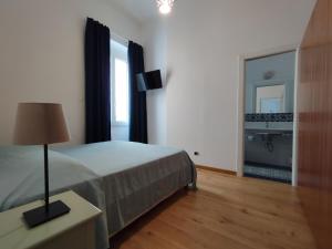 Postel nebo postele na pokoji v ubytování Locanda Mari