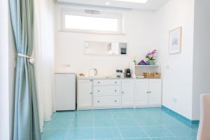 Η κουζίνα ή μικρή κουζίνα στο Aria - Suite in Capri