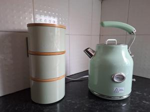 a green and white blender sitting on a counter at Cinematic Journeys in Nottingham +9 photos
