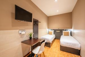 Katil atau katil-katil dalam bilik di Hotel Barry