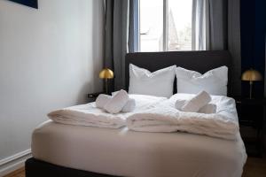 Postel nebo postele na pokoji v ubytování JUNIK Apartments - Deine Cityapartments in Duisburg