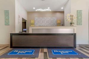 an office with a reception desk and two r recovery inn mats at Rodeway Inn Tuscaloosa near University in Tuscaloosa +33 photos