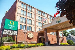 an exterior view of a hotel with a building at Quality Inn & Suites Downtown in Charlottetown