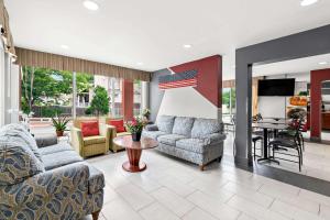 a living room with two couches and a television at Quality Inn Merrimack - Nashua in Merrimack