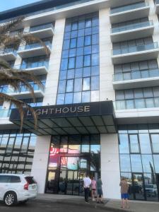 a group of people standing outside of a building at Light House Seabreeze Naradaran in Baku