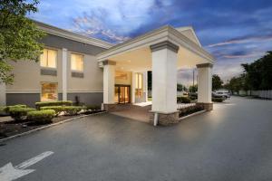 a building with a parking lot in front of it at Quality Inn Edison-New Brunswick in Edison
