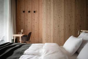 A bed or beds in a room at OLM Nature Escape - Eco Aparthotel