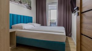 Кровать или кровати в номере VacationClub - Baltic Waves Resort Apartament B308 +14 фотографий