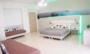 a bedroom with a bed and a couch at A'MANTIA HOTEL in Amantea