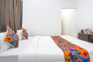 Postel nebo postele na pokoji v ubytování FabHotel White House Inn - EON IT Park