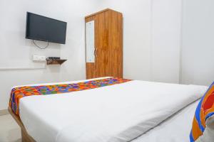 Postel nebo postele na pokoji v ubytování FabHotel White House Inn - EON IT Park