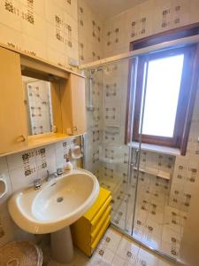 a bathroom with a sink and a shower at Casa del Fico in Santa Caterina di Nardò