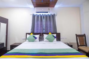 Ένα ή περισσότερα κρεβάτια σε δωμάτιο στο Treebo The Address Inn Mehdipatnam