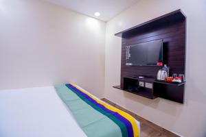 Ένα ή περισσότερα κρεβάτια σε δωμάτιο στο Treebo The Address Inn Mehdipatnam
