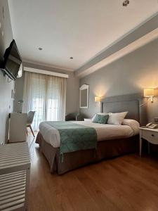 Postel nebo postele na pokoji v ubytování Hotel Costasol