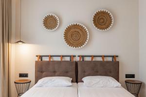 Postel nebo postele na pokoji v ubytování Kamara Rooms