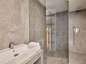 a bathroom with a sink and a shower at Apartment Trendy Mountain Terrace Retreat by Interhome in Svoboda nad Úpou