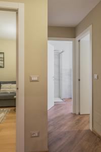 an empty room with a door and a bedroom at Ars Nova in Cuneo