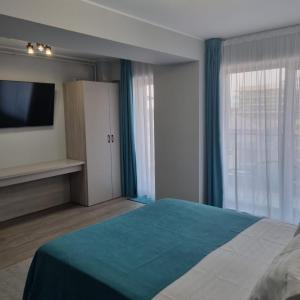 En eller flere senge i et værelse på Studio 64 by ZORA Rezidetial