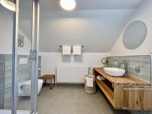 a bathroom with a sink and a toilet and a shower at Holiday Home Melvill by Interhome in Dittishausen