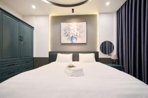 Postel nebo postele na pokoji v ubytování GALANG HOTEL
